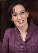 Mature office babe Shelly Jones naked on her desk.