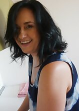 Mature housewife Ria Black gets naked on the kitchen counter.