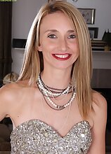 Petite MILF Heidi Van Moore spreads pussy.