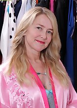 Busty mature amateur Eva Griffin naked in closet.