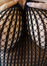 Big breasted mature babe Sandra rubs her naked body.