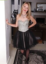 Petite MILF Heidi Van Moore spreads pussy.