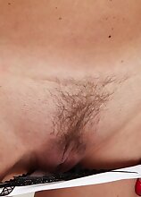 Blond housewife Ali Jones exposes her trimmed pussy.