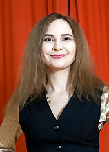 Adelis Shaman by the red curtains