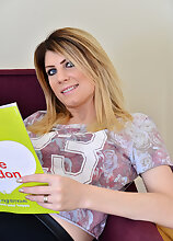 Beautiful Ashleigh Mckenzie reads her magazine, then does a striptease